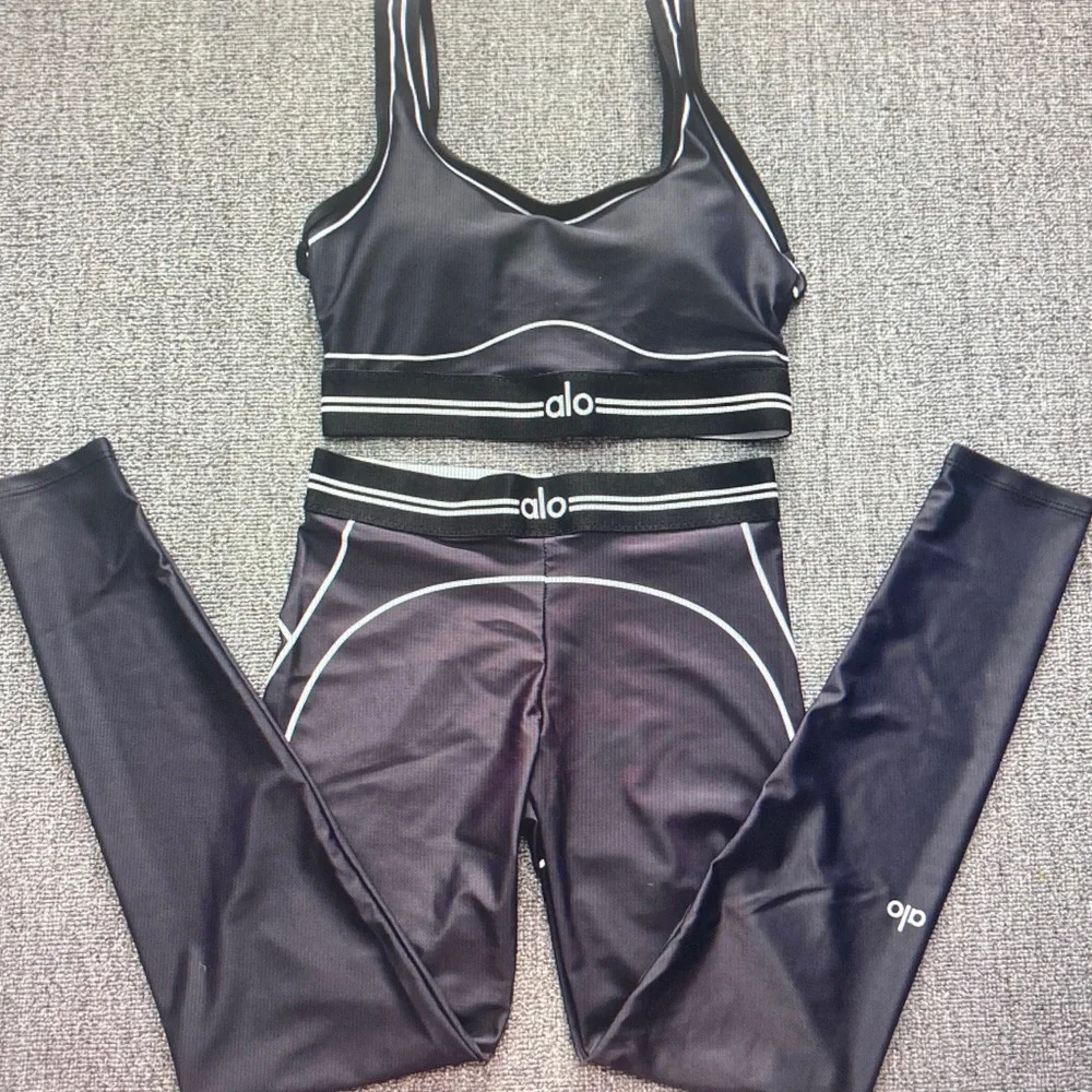 ALO Yoga Black Leggings with White Piping Detail
